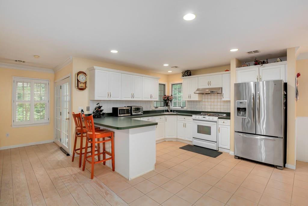 7 Cedar Brook Road Wellesley, MA 02482 - Photo 14 of 36 a kitchen with granite countertop a refrigerator and a stove top oven
