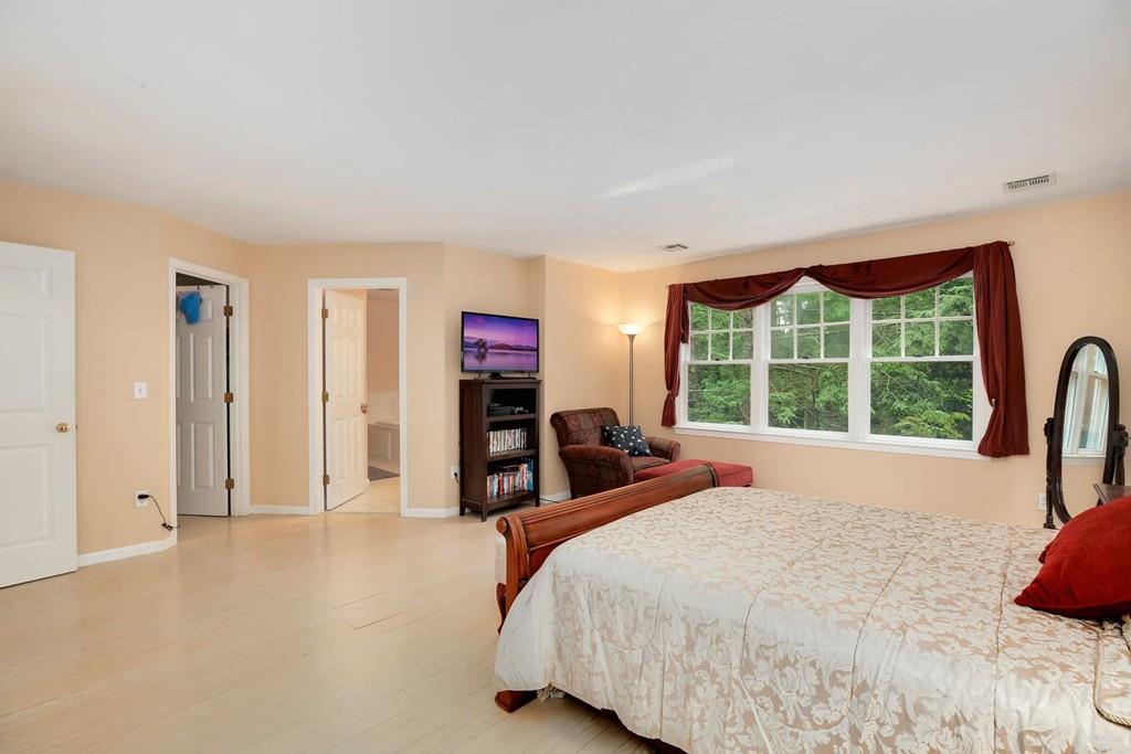 7 Cedar Brook Road Wellesley, MA 02482 - Photo 20 of 36 a bedroom with a bed and a large window