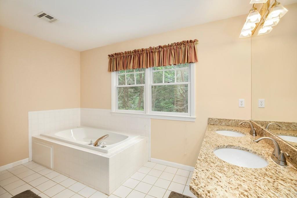 7 Cedar Brook Road Wellesley, MA 02482 - Photo 22 of 36 a bathroom with a tub sink and a window
