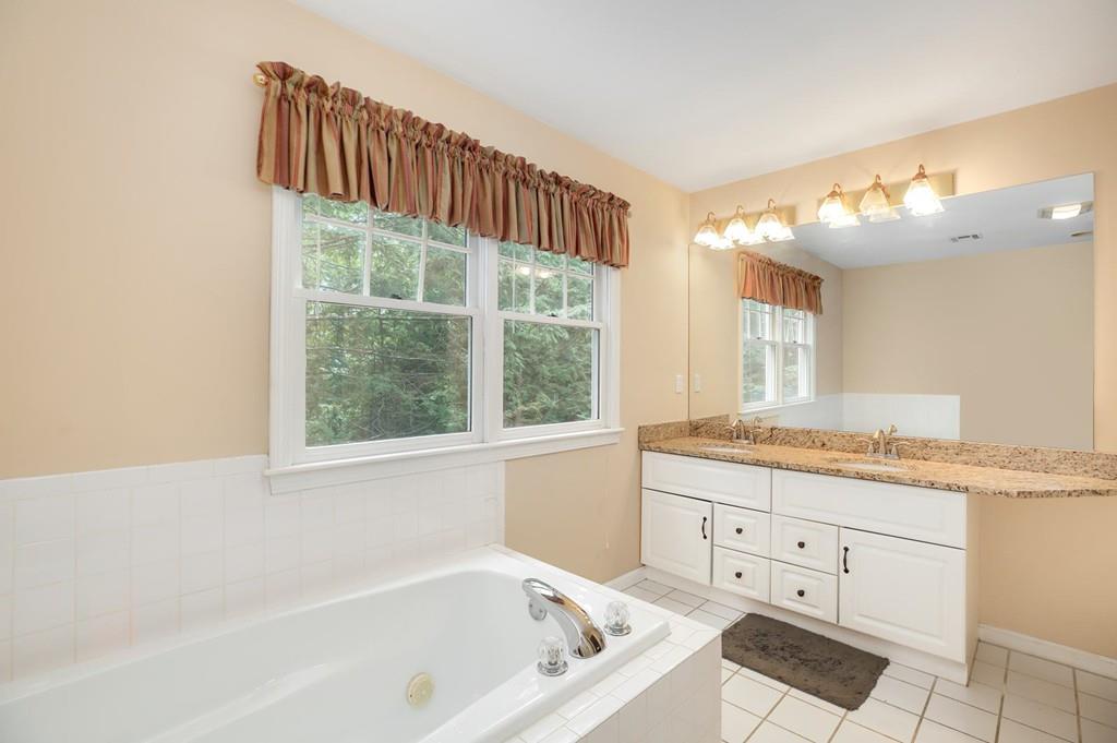 7 Cedar Brook Road Wellesley, MA 02482 - Photo 23 of 36 a bathroom with a granite countertop sink and a bathtub