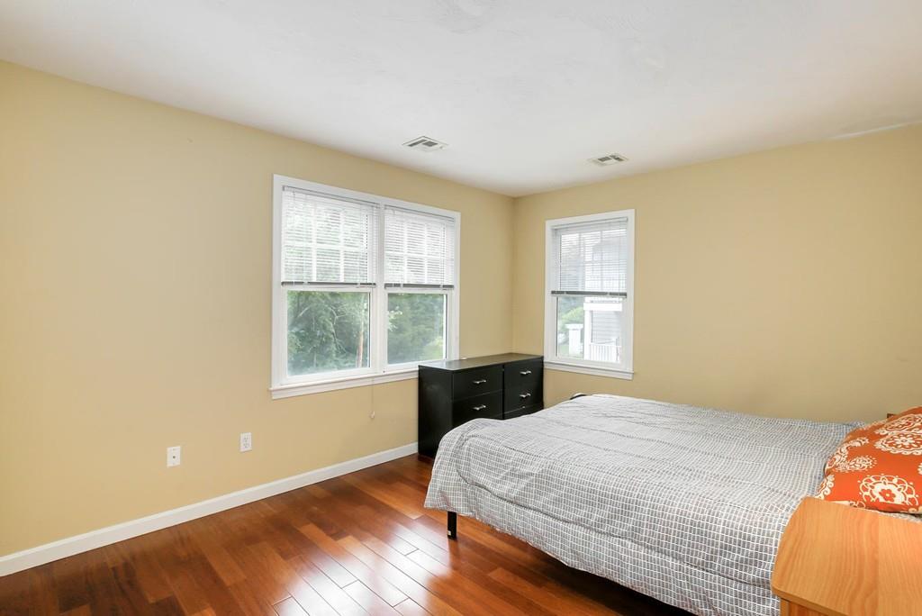 7 Cedar Brook Road Wellesley, MA 02482 - Photo 29 of 36 a bedroom with a bed and wooden floor