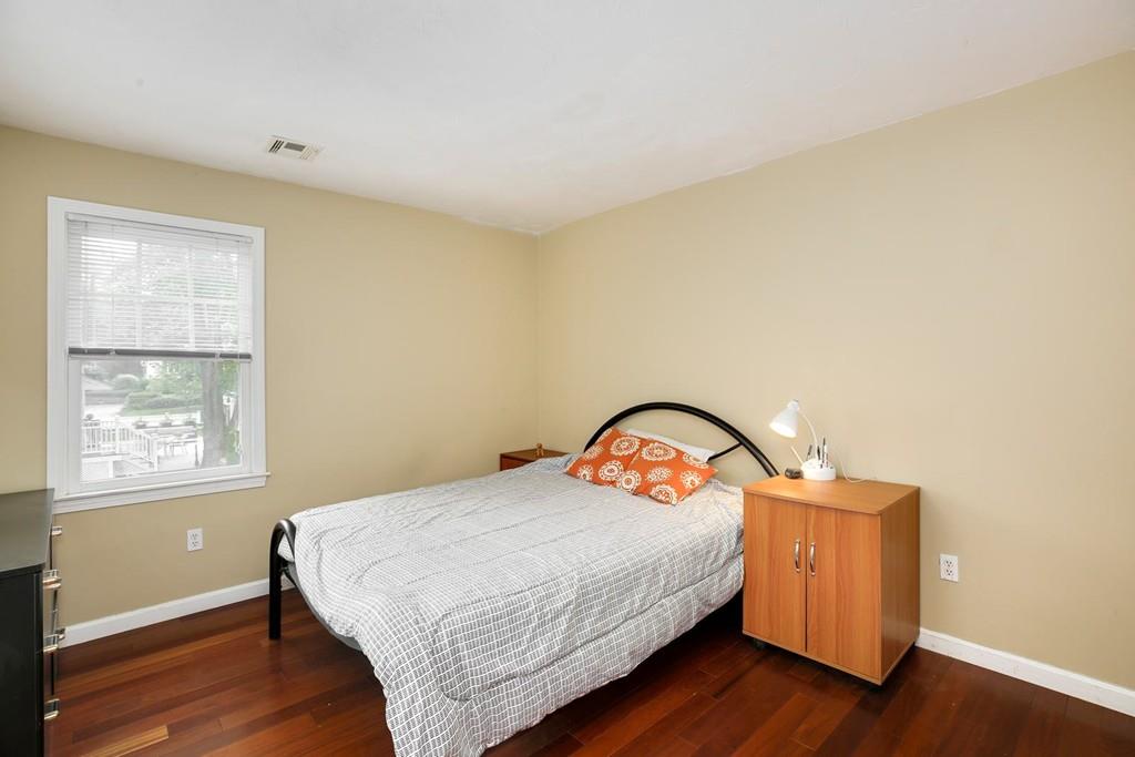 7 Cedar Brook Road Wellesley, MA 02482 - Photo 30 of 36 a bedroom with a bed and a window
