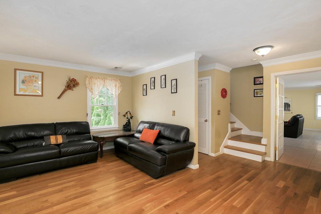 7 Cedar Brook Road Wellesley, MA 02482 - Photo 6 of 36 a living room with furniture and a flat screen tv