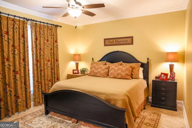 a bedroom with a bed and a night stand