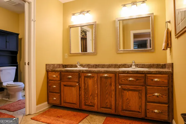 a bathroom with a toilet and a sink