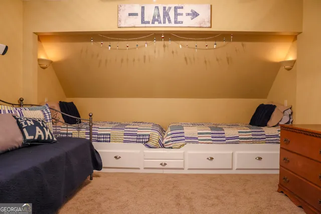 a bedroom with a bed and cabinets