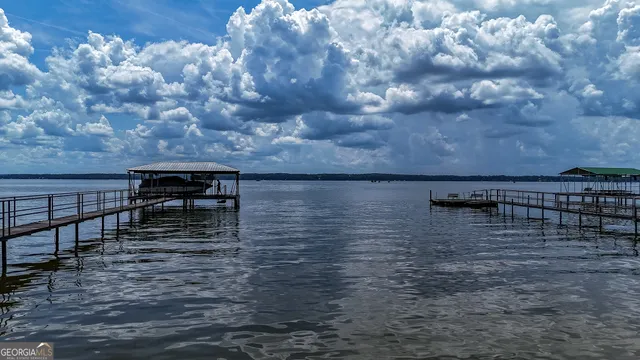 a view of wooden staircase with a lake