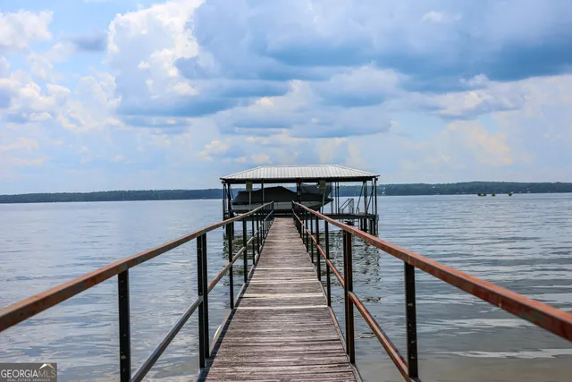 a terrace with wooden floor and outdoor seating