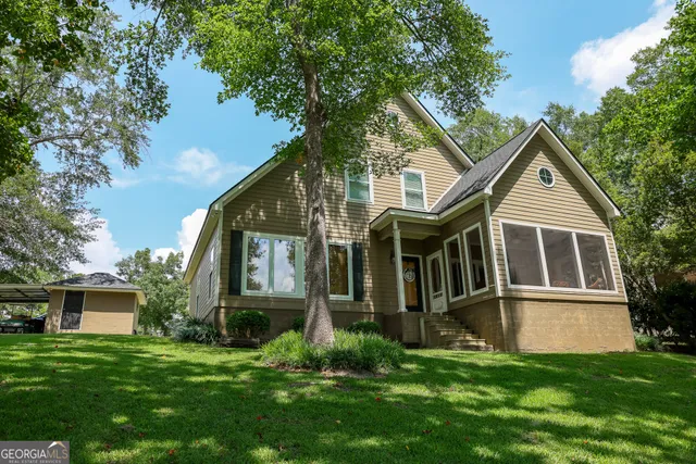a front view of a house with a yard