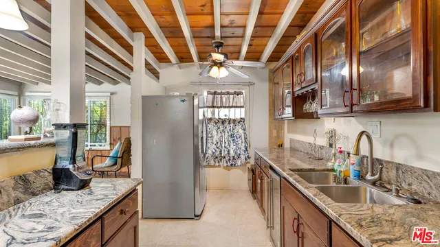 a view of walk in closet with wooden floor