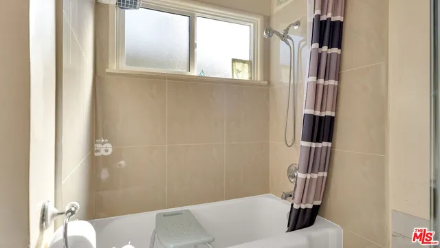 a view of balcony with wooden floor and fence