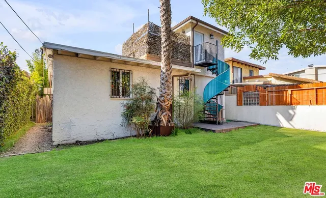a view of a house with a yard and garage