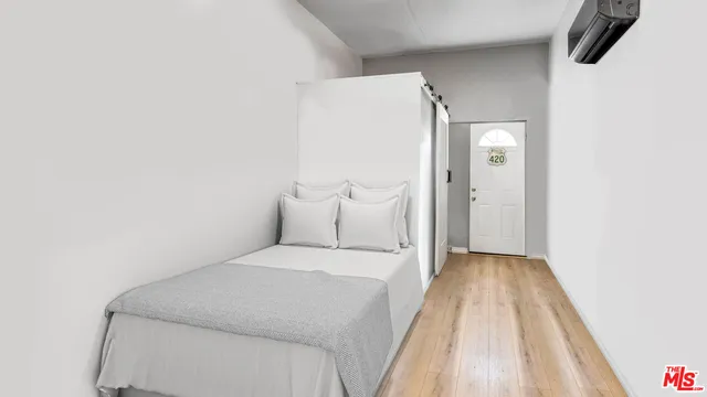 a view of a room with a wooden door