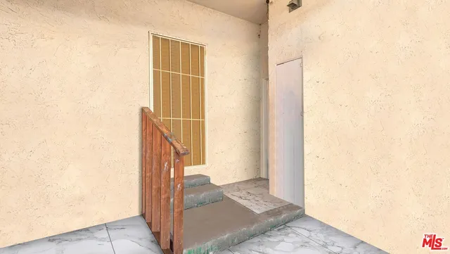 an aerial view of multiple houses with a swimming pool