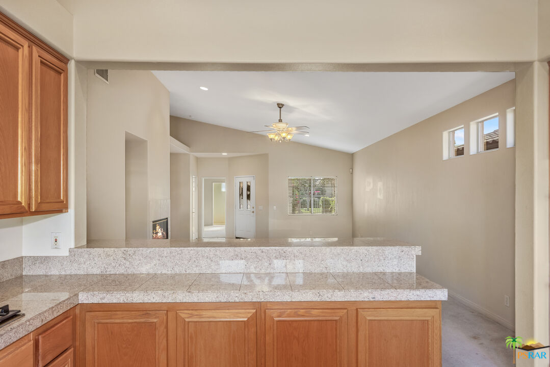 80372 Pebble Beach Drive Indio, CA 92201 - Photo 11 of 35 a bathroom with a granite countertop sink a mirror and vanity