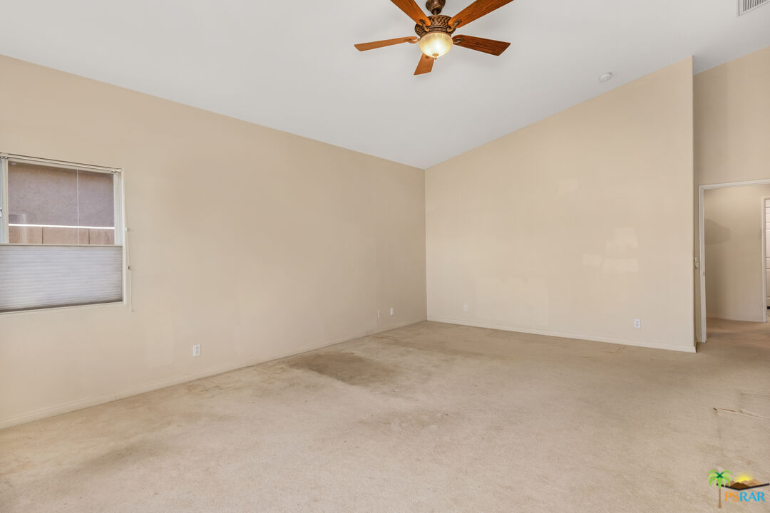 80372 Pebble Beach Drive Indio, CA 92201 - Photo 14 of 35 an empty room with a window and a fan
