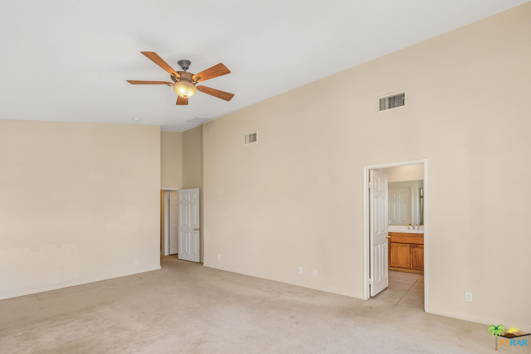 80372 Pebble Beach Drive Indio, CA 92201 - Photo 15 of 35 a view of a livingroom with a ceiling fan and window