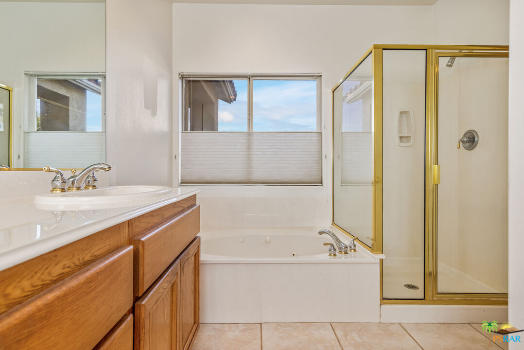 80372 Pebble Beach Drive Indio, CA 92201 - Photo 18 of 35 a bathroom with a tub sink and mirror