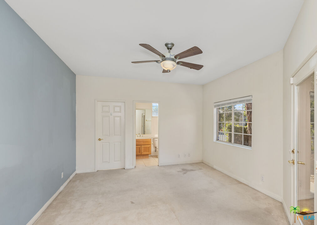 80372 Pebble Beach Drive Indio, CA 92201 - Photo 22 of 35 a view of an empty room with a window
