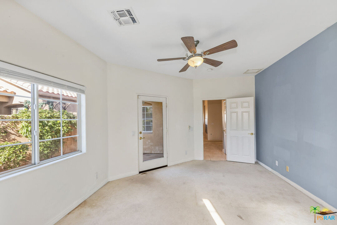 80372 Pebble Beach Drive Indio, CA 92201 - Photo 24 of 35 a view of an empty room with a window