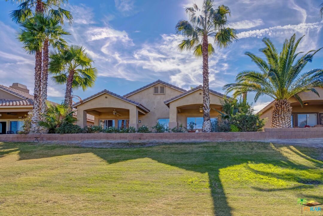 80372 Pebble Beach Drive Indio, CA 92201 - Photo 28 of 35 a view of house with swimming pool and a yard