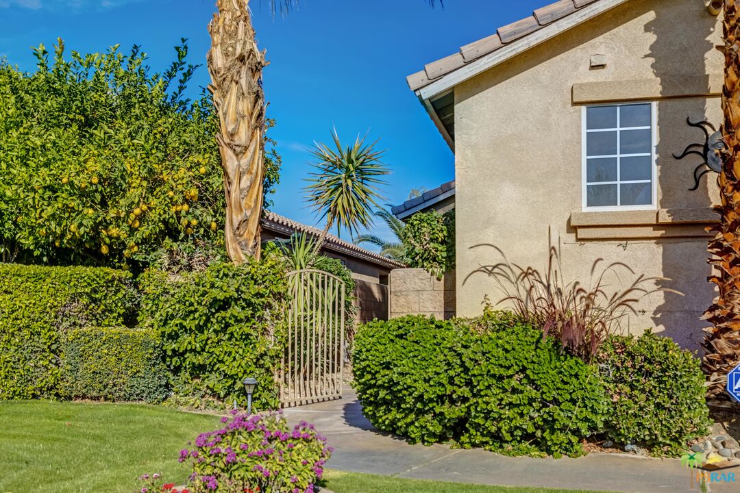 80372 Pebble Beach Drive Indio, CA 92201 - Photo 34 of 35 front view of a house with a yard