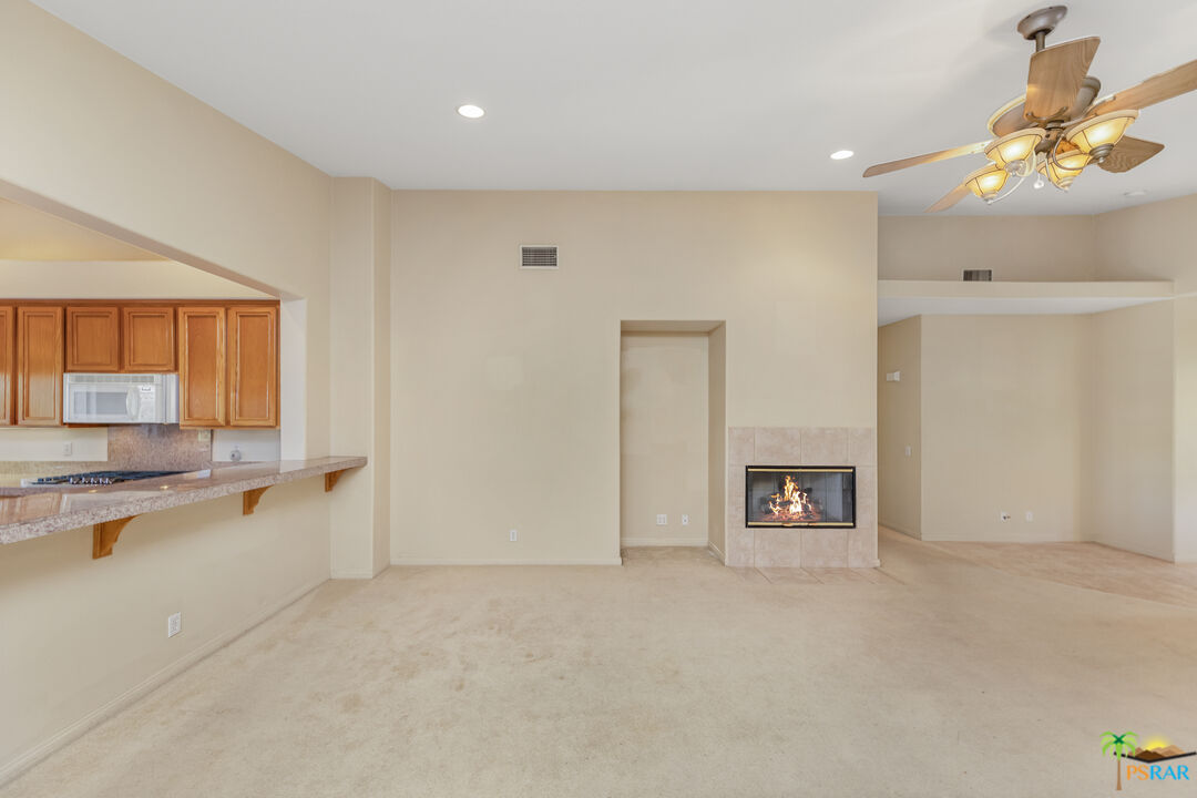 80372 Pebble Beach Drive Indio, CA 92201 - Photo 4 of 35 a view of a kitchen with a sink and a fireplace