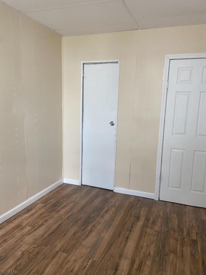 520 East 24th Street, Unit 1 Paterson, NJ 07514 - Photo 1 of 9 a view of an empty room with wooden floor