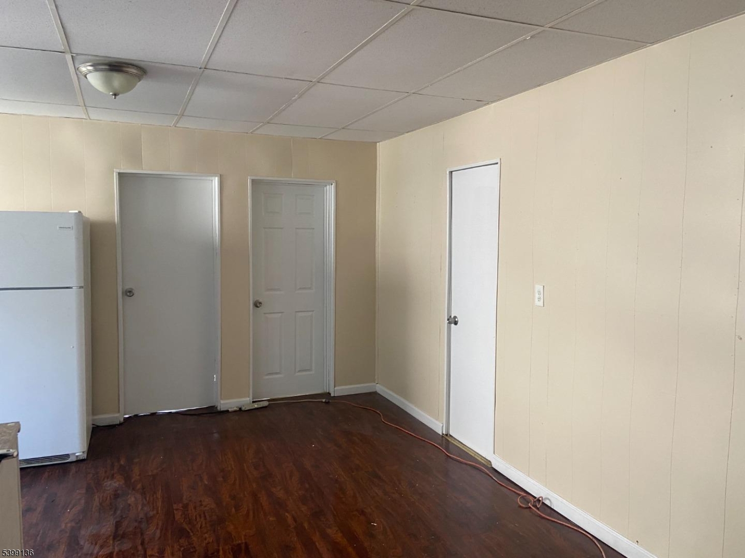 520 East 24th Street, Unit 1 Paterson, NJ 07514 - Photo 5 of 9 a view of an empty room with wooden floor and a window