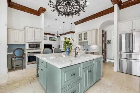 a kitchen with a sink counter top space and appliances