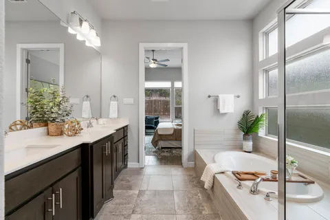 a living room with a couch and chandelier