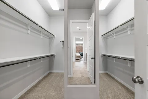 a view of an empty walk in closet