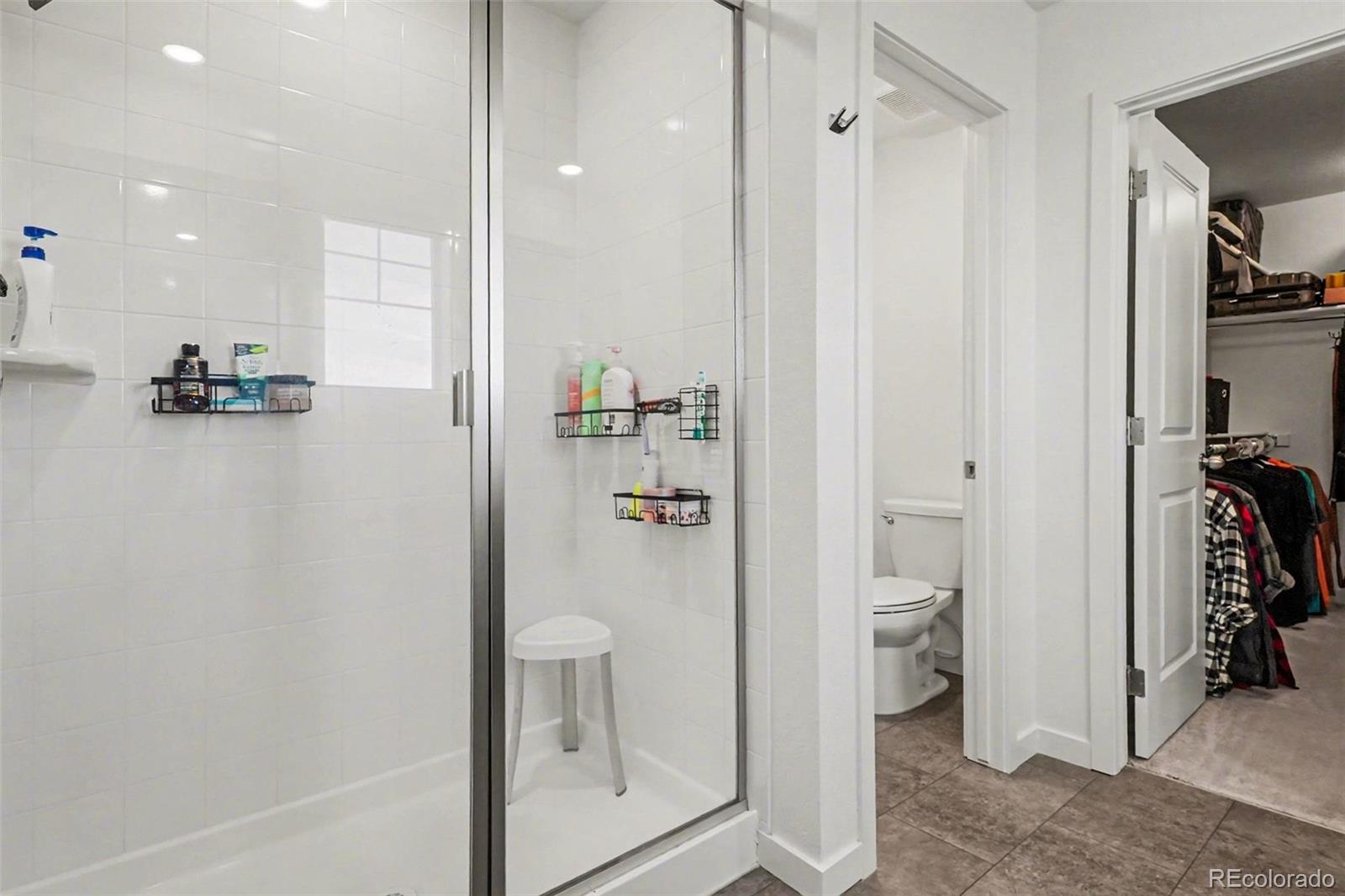 1053 Highpoint Trail Elizabeth, CO 80107 - Photo 16 of 28 a bathroom with a shower and toilet