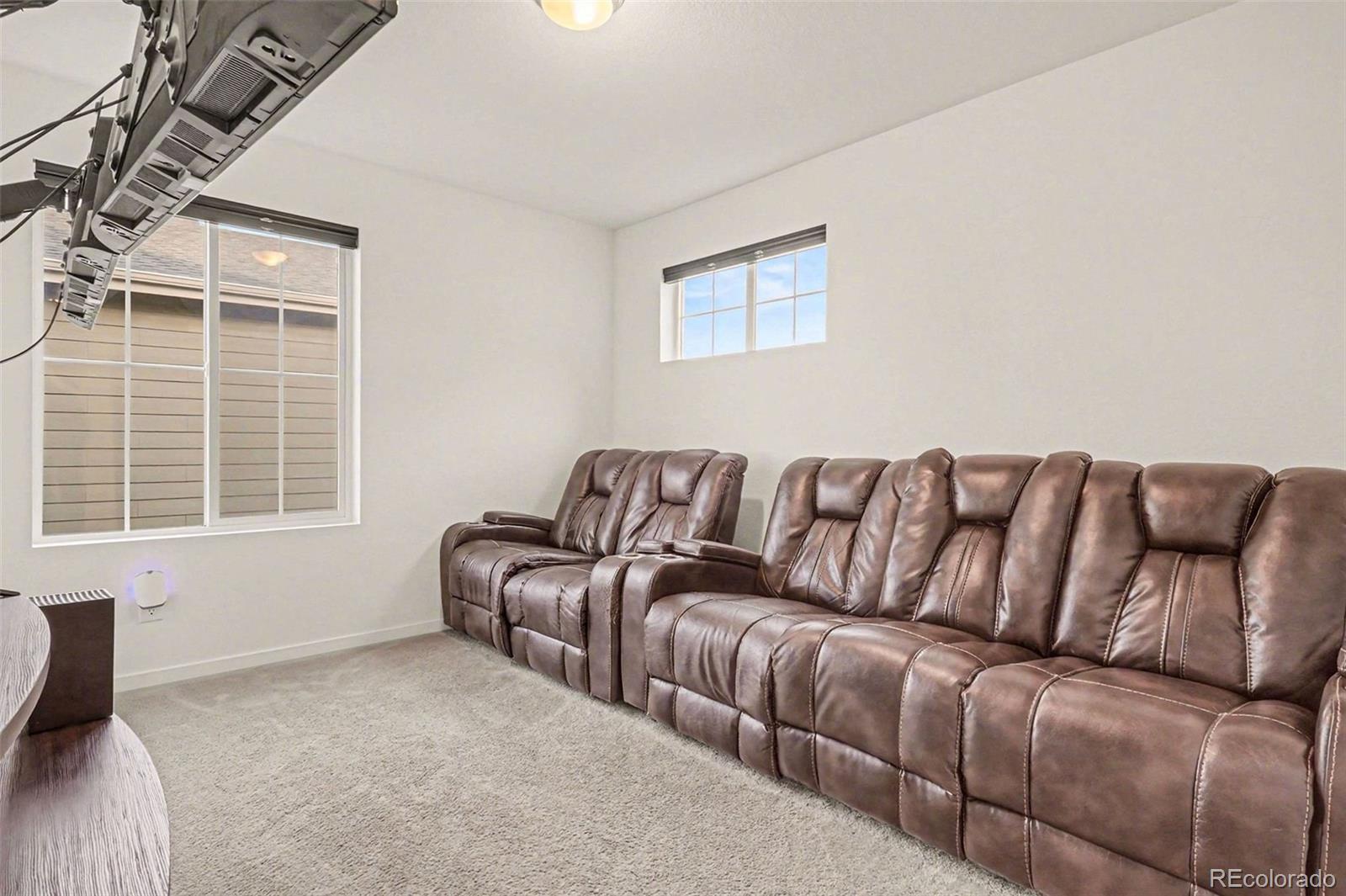 1053 Highpoint Trail Elizabeth, CO 80107 - Photo 17 of 28 a living room with couches chair and a large window