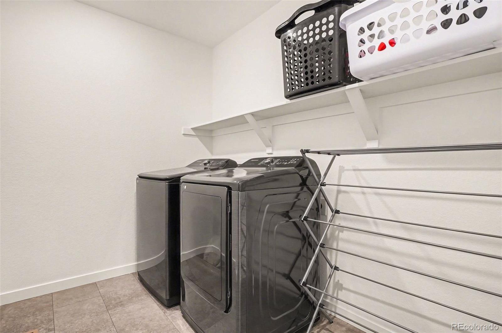 1053 Highpoint Trail Elizabeth, CO 80107 - Photo 20 of 28 a utility room with dryer and washer