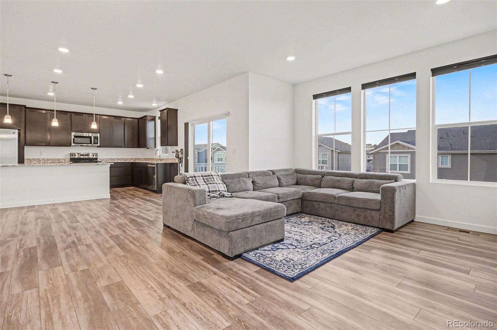 1053 Highpoint Trail Elizabeth, CO 80107 - Photo 3 of 28 a living room with furniture and a large window