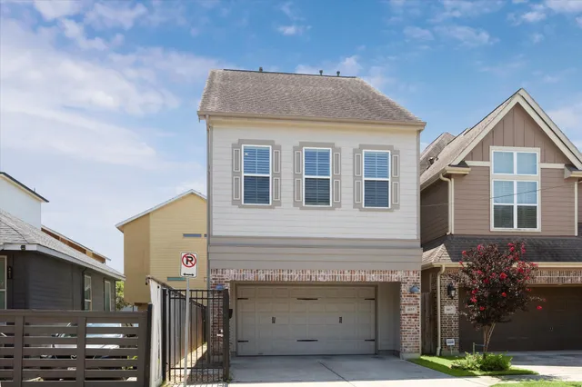 a front view of a house with garage