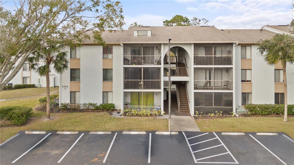 8203 Sun Spring Circle, Unit 12 Orlando, FL 32825 - Photo 38 of 38 a front view of a house with a yard