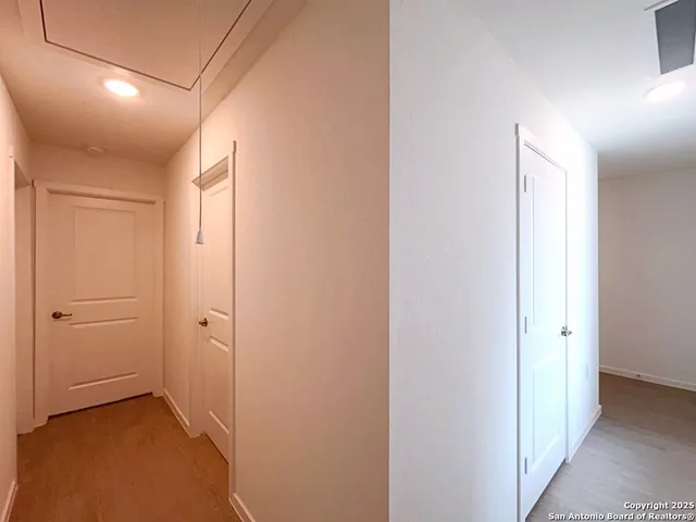 a view of a hallway with closet