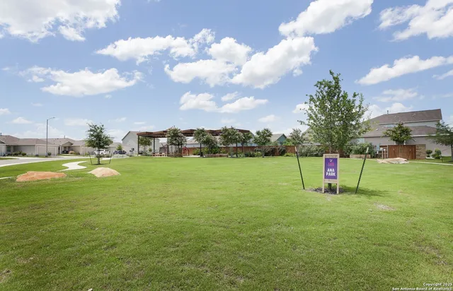 a view of a golf course with a lake