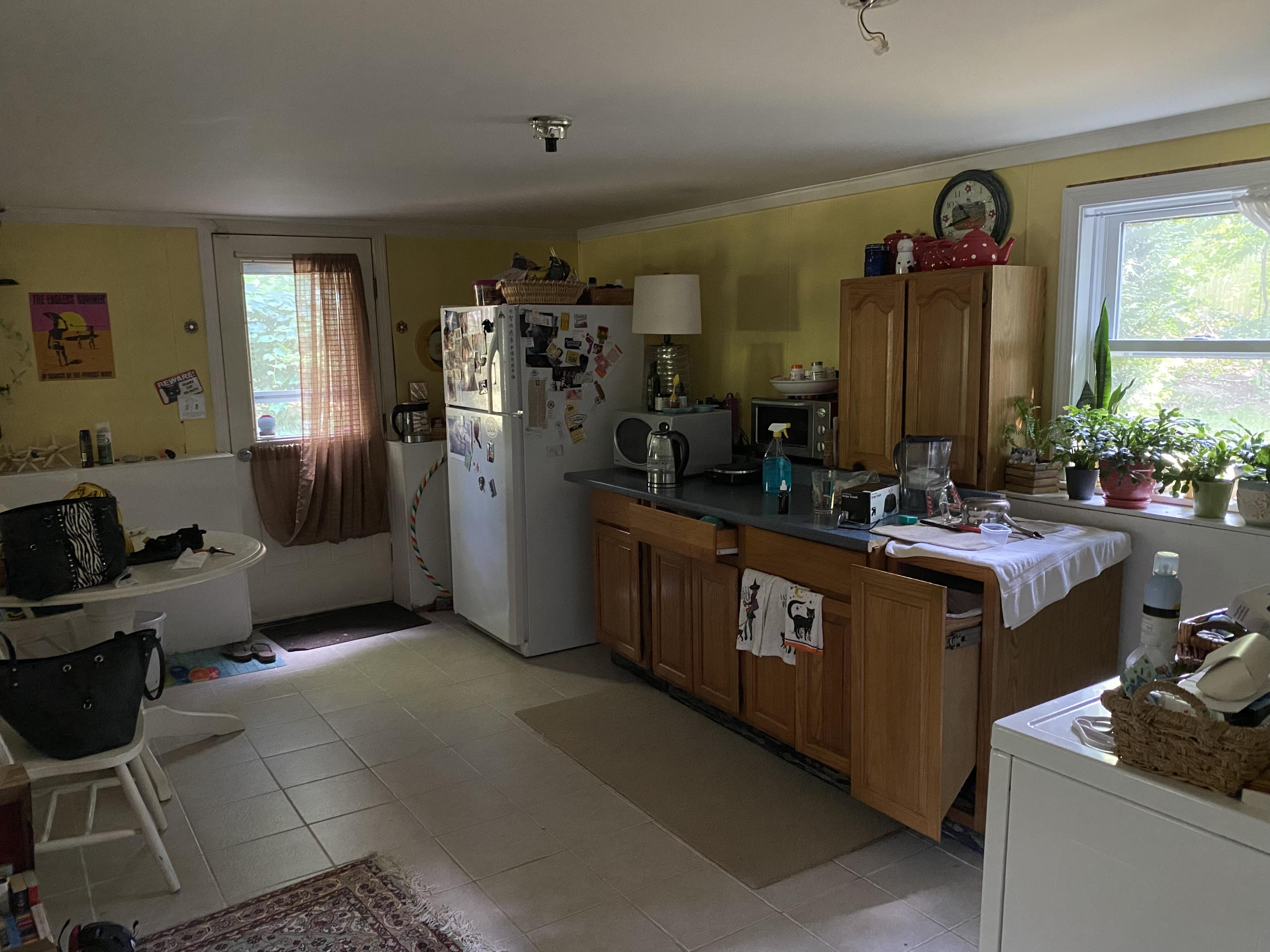 331 Ames Way Centerville, MA 02632 - Photo 15 of 16 a kitchen with stainless steel appliances granite countertop a sink stove and cabinets