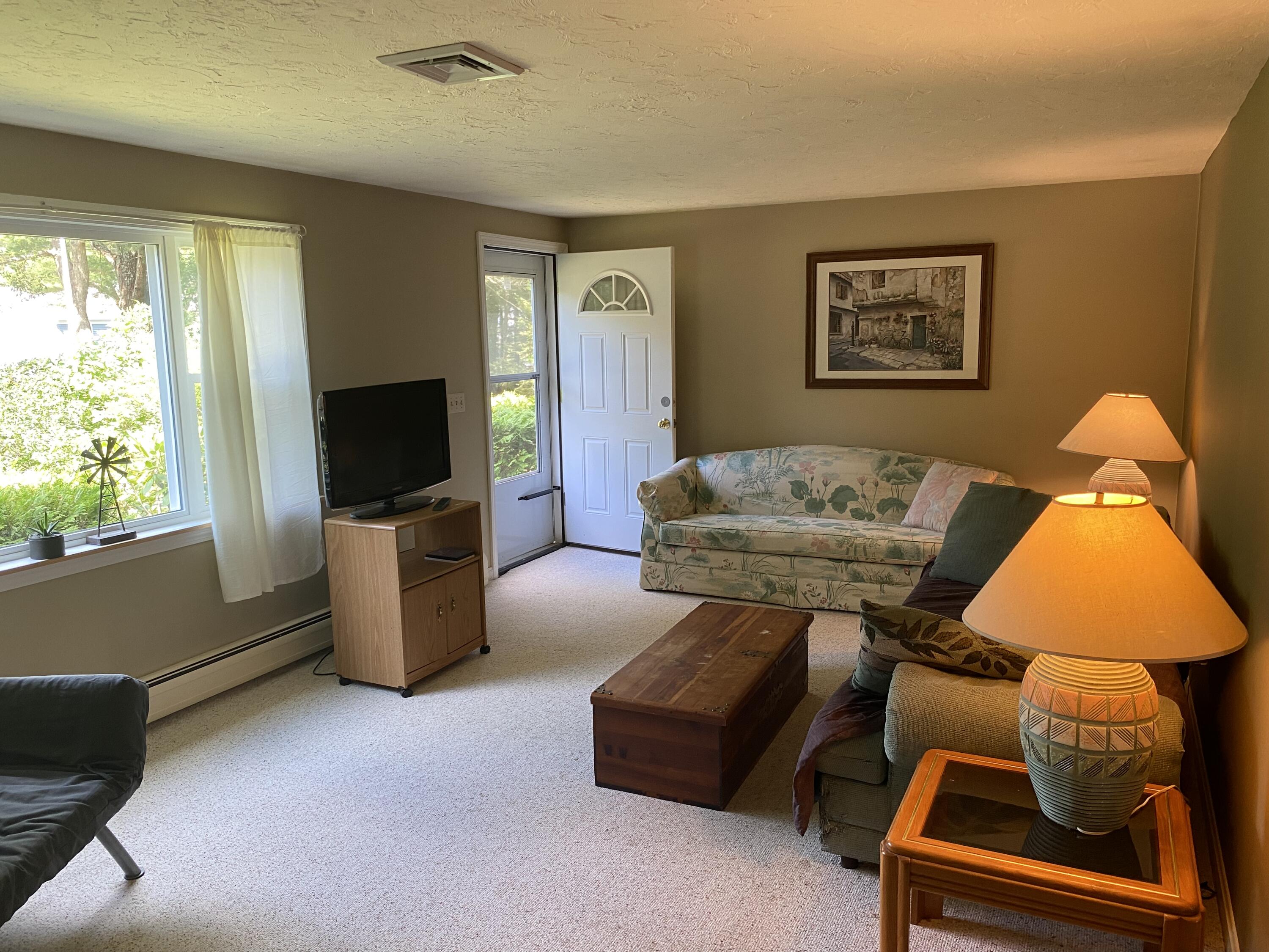 331 Ames Way Centerville, MA 02632 - Photo 6 of 16 a living room with furniture and a flat screen tv