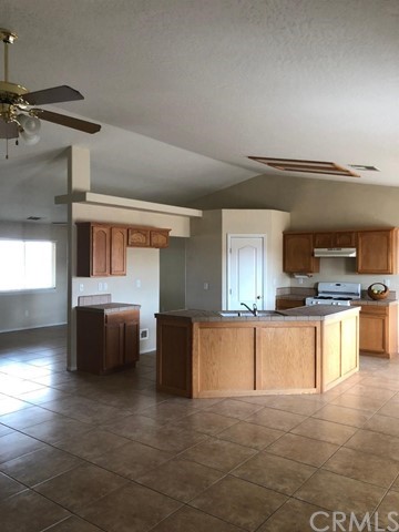 21307 Bear Valley Road Apple Valley, CA 92308 - Photo 1 of 1 a view of kitchen with furniture and window