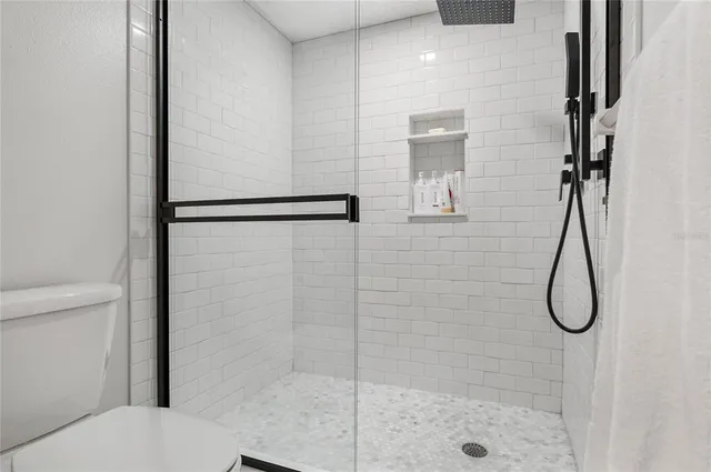 a large white bed in a white room