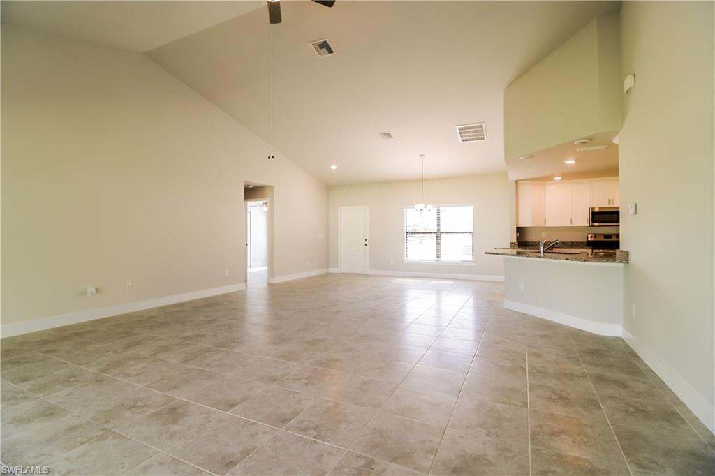 1004 Anson Avenue Lehigh Acres, FL 33971 - Photo 5 of 15 a view of an empty room and kitchen view
