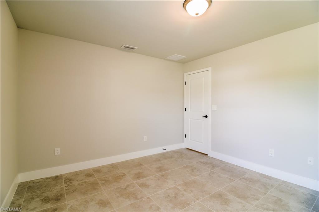 1004 Anson Avenue Lehigh Acres, FL 33971 - Photo 9 of 15 a view of an empty room