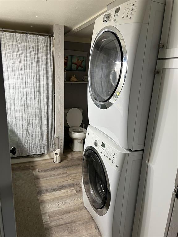 2334 San Bar Road, Unit 54 Graford, TX 76449 - Photo 13 of 28 a view of a storage & utility room with washer and dryer