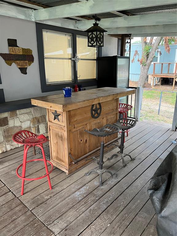 2334 San Bar Road, Unit 54 Graford, TX 76449 - Photo 17 of 28 a room with gym equipment and view of living room