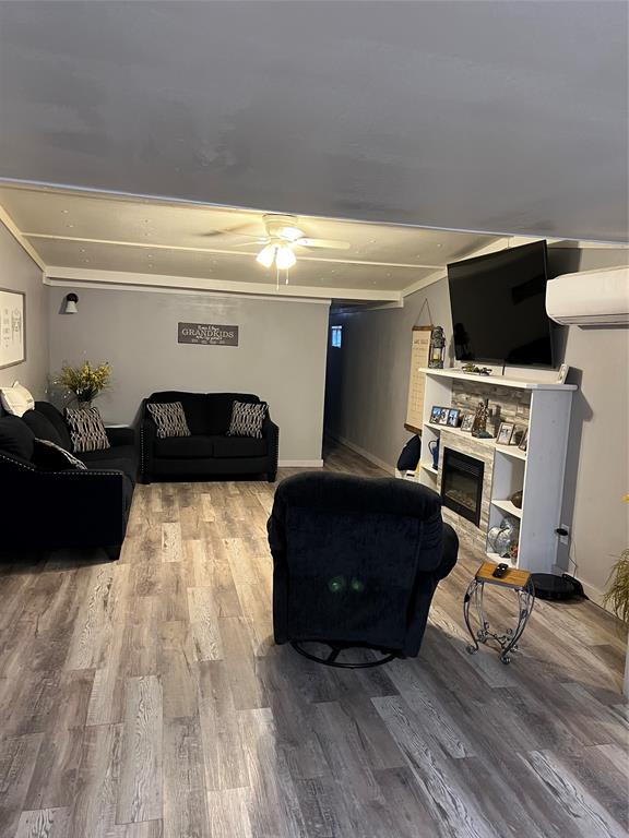 2334 San Bar Road, Unit 54 Graford, TX 76449 - Photo 4 of 28 a living room with furniture and a flat screen tv