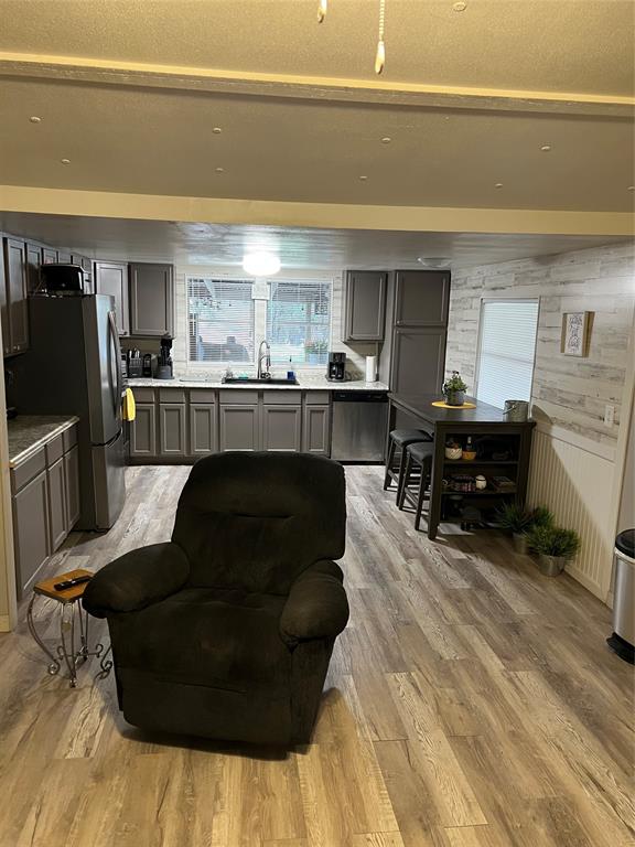 2334 San Bar Road, Unit 54 Graford, TX 76449 - Photo 28 of 28 a living room with furniture and a flat screen tv